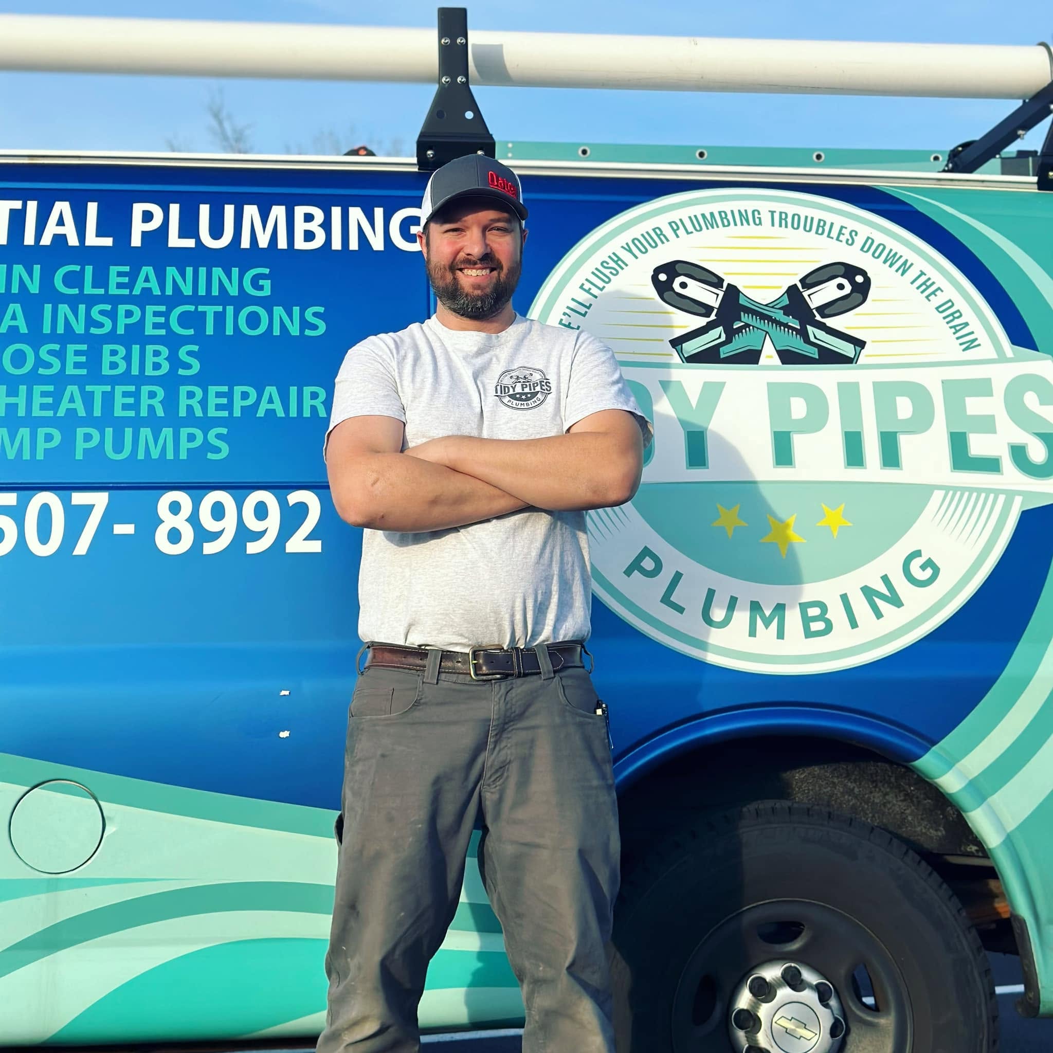 Nick Parlet, owner of Tidy Pipes Plumbing, in front of his van